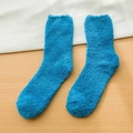 Soft blue coral fleece mid-calf socks for winter warmth on wooden background - One Size / Teal