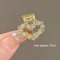 Detail view of 2.5cm gold heart hair claw clip with sparkling rhinestones for women - 9# Heart Rhinestone