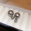 Macro view of gray double pearl earrings set in a beige velvet jewelry gift box - Steel Needle - Grey