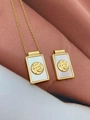 Close-up of gold rectangular mother of pearl pendants with Fe faith relief engraving - Necklace A-Fe Faith