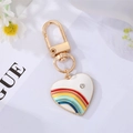 White heart keychain with rainbow pattern, gold-tone metal, and sparkling rhinestone charm - White Heart Rainbow