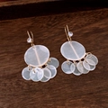 Detail of elegant gold earrings with white crystals and translucent resin discs on wood - White Disc Layered Style (12#)