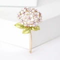 Detail of white enamel hydrangea brooch with pink crystals and golden metal stem - White