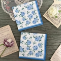 Disposable paper napkins with blue rose floral print and elegant scalloped edges - Blue Framed Rose