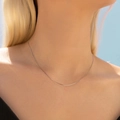 Delicate S925 sterling silver box chain necklace for women shown on a model neck - 925 Silver / Box Chain