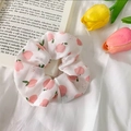 Organza hair scrunchie in white with pink apple pattern on soft fabric background - Pink Apple