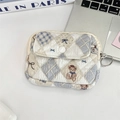Detailed view of quilted teddy bear organizer bag with flap closure and key ring - Diamond Bear