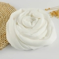Detailed texture of white linen scarf styled as a rose with raw frayed edges - 190x100cm / White Bubble Shape 9.7cm