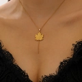 Gold maple leaf pendant necklace featuring delicate vein textures on a chic link chain - Gold Hollow Maple Leaf Necklace (WG-1217)