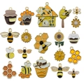 Flat lay of 19 assorted enamel honey bee, honeycomb and sunflower charms for DIY jewelry - Mixed 20pcs New Bee Series Set