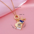 Gold-plated necklace with camera, airplane, and blue globe pendants and zircons - Camera/Airplane/Earth