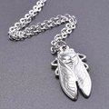Macro shot of vintage silver cicada pendant with detailed wings on stainless steel chain - Pendant + 50cm Necklace / Steel