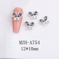 Macro shot of 12x10mm 3D butterfly nail charms with silver metal edges and grey rhinestones - Dark Grey Butterfly with Silver Base (A754)