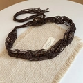 Bohemian handmade macrame waist belt with dark wooden beads and tassel on white background - Coffee