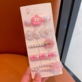 Close-up of 5pcs set pink rhinestone pearl hair clips on card held by hand - Flower 5-piece Set