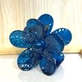 Detail of translucent blue flower hair claw clip with silver glitter and metal spring - Blue