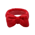 Soft red coral fleece headband featuring a large plush bow design for face washing - Red