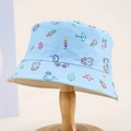 Close-up of children's blue bucket hat with colorful animal prints on a wooden stand - Blue / 54cm (3-8 Years)
