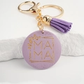 Detail of a purple round mama keychain with leopard pattern and gold-tone tassel - Light Purple