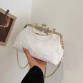 White shell evening bag with 3D floral embroidery, sequins, and golden bow clasp - White