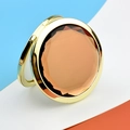 Portable golden round makeup mirror with a large amber faceted gemstone crystal - Gold Crystal Amber