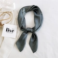 Gray-blue silk square scarf with paisley pattern styled on a white shirt - Green Paisley Spot Pattern