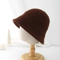 Detailed close-up of thick coffee brown knit bucket hat with soft plush texture on stand - Adjustable / Brown