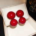 Close-up of vibrant red spherical stud earrings on a cream-colored jewelry display pad - Glossy Red Spherical Earrings 4pcs Set (53# Silver Earring Post-Gold-Red)