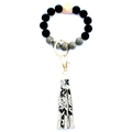 Close-up of beaded keychain featuring black matte beads, wood accents, and snakeskin tassel - Style 5 (Black White Grid Snake Tassel)