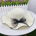 Close-up of beige sun hat featuring wavy brim and delicate double-layered bow detail - M (56-58cm) with Windproof Rope / Creamy White