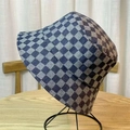 Blue-grey checkerboard denim bucket hat for women on a professional display stand - One Size / Dark Blue