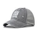 Detailed view of the distressed grey trucker hat featuring a bold white 'I FIX STUFF' print - Adjustable / Gray