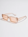 Macro shot of stylish square sunglasses in transparent peach pink with Y2K retro frame - C16 Champagne Light Coffee Lens