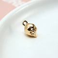 Close-up of a golden fox-shaped DIY metal pendant on a white ceramic plate - 09# Pinecone 2