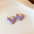 Macro shot of heart-shaped purple tiger eye earrings with golden metal edges on white tray - 9# Purple Pearlescent Heart Ear Clip