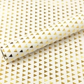 White gift wrapping paper with metallic gold foil triangle patterns for elegant packaging - Triangle
