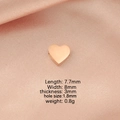 Macro detail of rose gold heart bead with size dimensions on pink satin background - 8*8mm Heart-Shaped Bead with Small Hole / Rose Gold