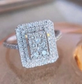 Elegant silver-toned halo ring with rectangular pave-set cubic zirconia crystals - Ur0674