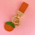 Süßer Schlüsselanhänger in Orangenform aus Leder mit grünen Blättern und Goldring - Oranges Leder [Orange Frucht]
