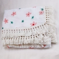 Close-up of floral print cotton baby blanket with decorative beige tassel edges - Custom Size / Red Flower