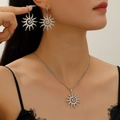 Detailed close-up of a silver sunflower necklace and earrings set worn by a model - Steel Color Sun Earrings and Necklace Set (2Pcs)