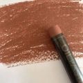 Single brown oil pastel for art students, showing rich texture and bold strokes on paper - Antique Bronze