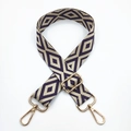 Detail of embroidered geometric purple and beige diamond patterned wide guitar strap - Silver Clasp / Beige Base Dark Purple