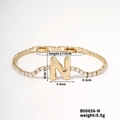 Gold tone letter N bracelet with sparkling cubic zirconia inlay and 17+2cm adjustable chain - Letter N
