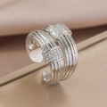 Anello aperto argento a strati intrecciati con pavé di zirconi dal design di lusso - Argento
