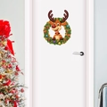 Autocollant de porte couronne renne de Noël avec décors sur une porte blanche - Couronne de Renne de Noël