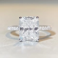 Macro shot of 4 carat radiant cut moissanite ring with pavé diamonds on silver band - US 5 / Rectangular Halo 4ct-Silver