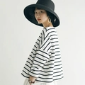 Classic wide-brim black straw hat paired with a French Hepburn style beach ensemble - Adjustable / Black