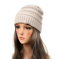 Winter knitted beanie for women in beige featuring a chunky ribbed pattern and cozy fit - Off White