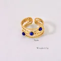 Detail shot of 9mm wide gold bohemian ring with three blue stones and weight specs - Lapis Lazuli